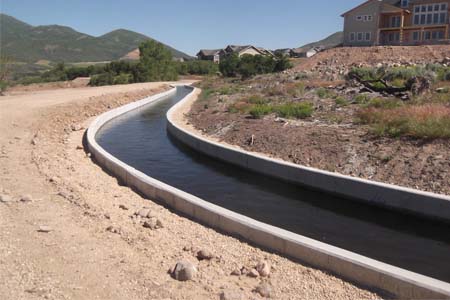 picture of a canal that has been lined to reduce water loss